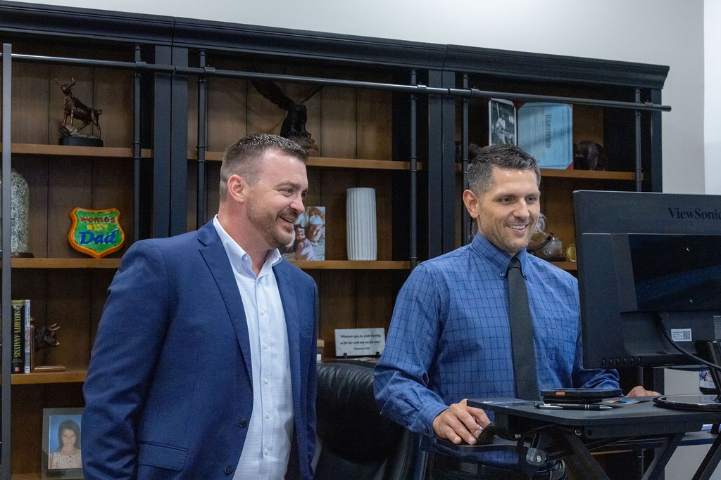 John Glaudel and Michael Phillips at the Phillips Financial Management office